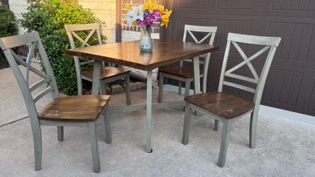Beautiful Wooden Dining Set. Table with 4 matching chairs. Good condition, very sturdy!