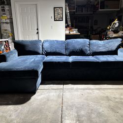 Blue couch with a L shape end. Perfect quality and a really cozy comfortable couch