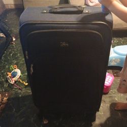 A Large Sized Suit Case And A Small Size Suitcase 