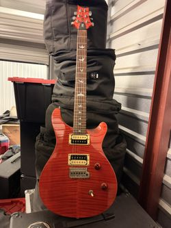 PRs SE Electric Guitar With Case.