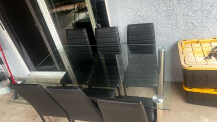 Modern glass table with 6 leather chairs