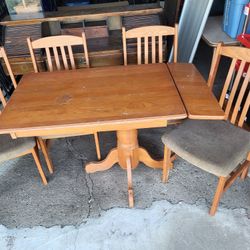 Oak dining table drop-leaf and set of 4 cushioned chairs