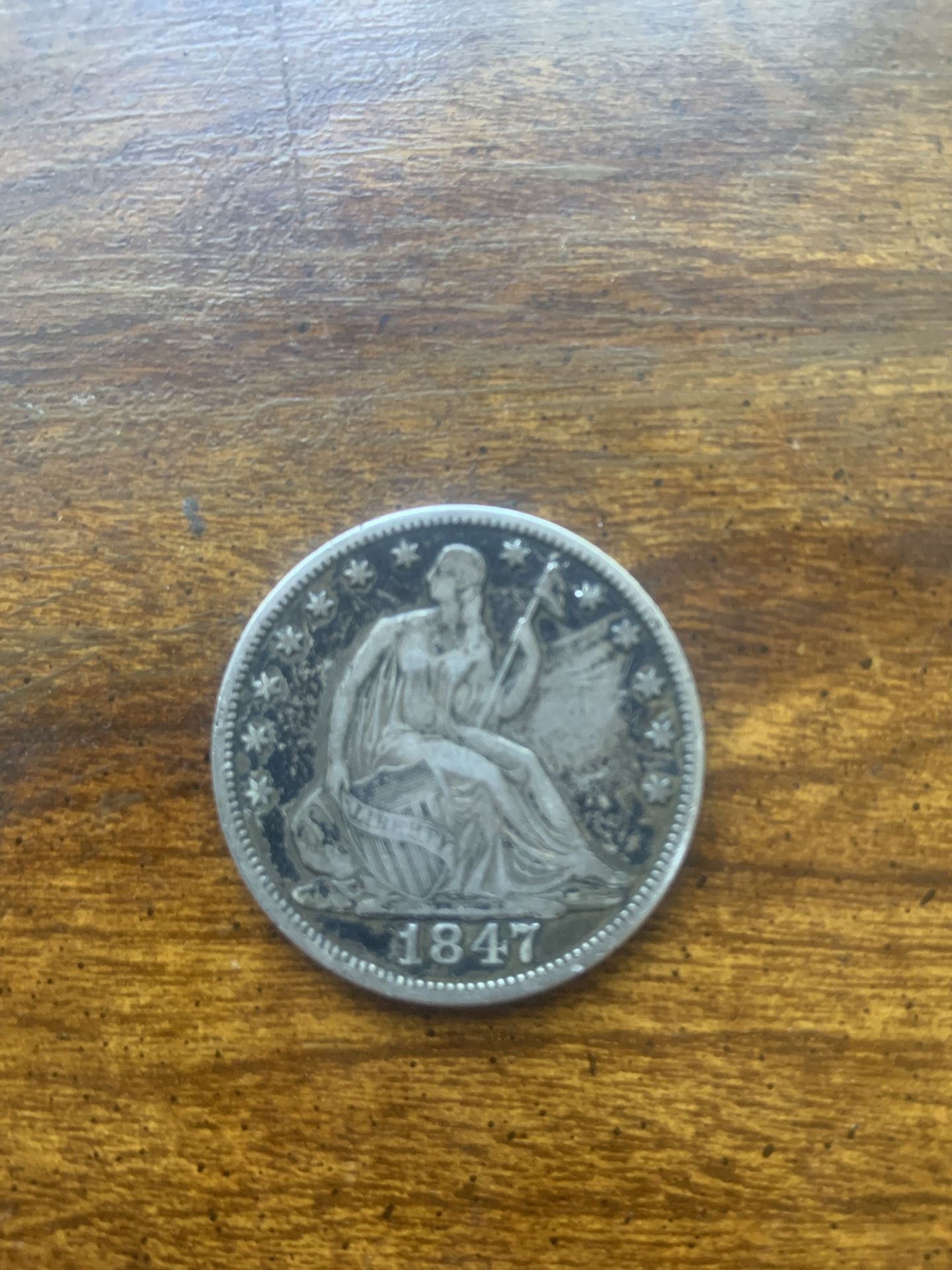 1847 Seated Liberty Half Dollar coin. 
