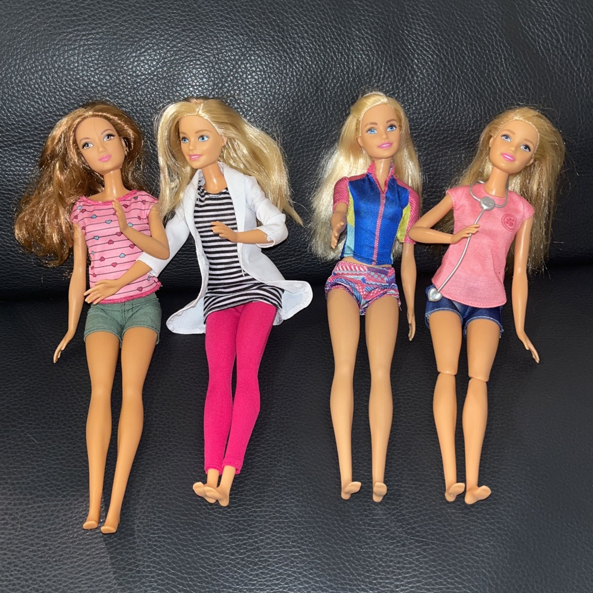 Four Barbie Dolls From 2015 And 2013 With Clothes 