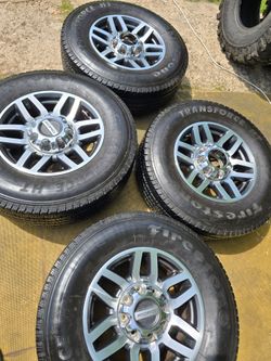 Ford wheels 8 lugs good tires 90%