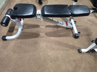 Bench with leg curl and leg extension attachment and preacher curl attachment