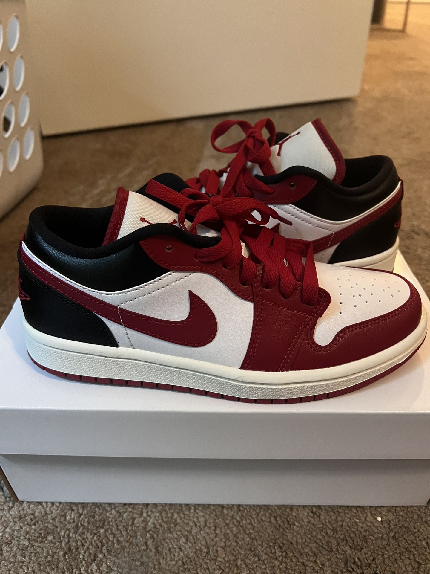 Woman’s Air Jordan 1 Low Red And Black
