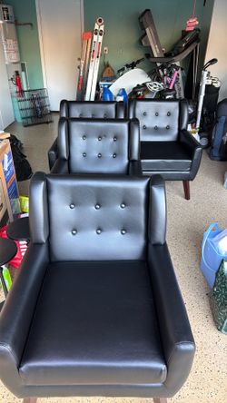 4 black faux leather chairs