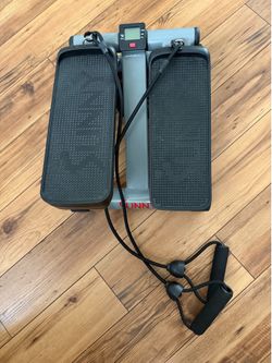 Sunny Health & Fitness Mini Stepper equipped with resistance bands for a full-body workout.