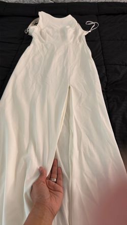 Size 7 elegant white dress with rhinestone back straps.