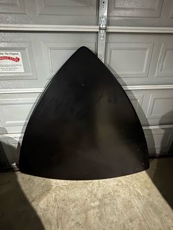 Black triangle table with two benches.