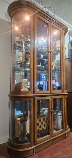 Cabinet 4 door oak curio with beveled glass and lighting by Pulaski Furniture