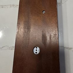 Barometer and thermometer with hygrometer on a mahogany wood base. Measures 12.5 inches high x 6 inches wide