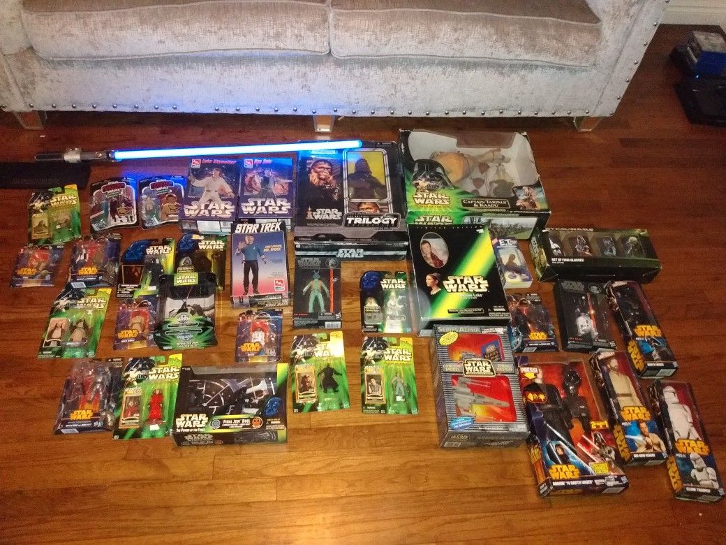 Star wars action figures in their original packaging and used 2005 Lucas film ltd lightsabier.