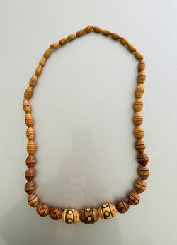 Wooden beaded necklace with hand-decorated beads