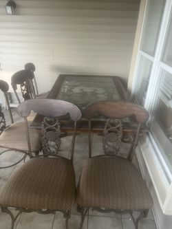 Glass Table With 6 Chairs And A Couch 