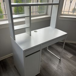 White desk with drawers and shelves