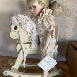 Porcelain Doll with rocking horse