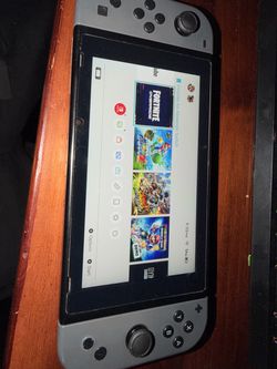 Nintendo oled black and grey come with games
