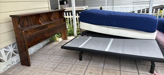 Two adjustable motorized Twin XL beds with mattresses and bases