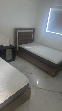Two twin bed with mattress a nightstand