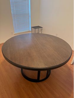 Round wooden dining table
