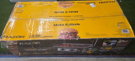 New 25 in. 2-Burner Portable Propane Gas Griddle with Lid and Folding Cart in Black, new in unopened box