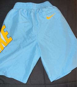 Nike Light Blue Shorts with Yellow Logo