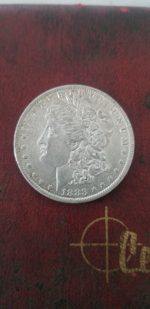 1883-O marked Morgan Silver Dollar