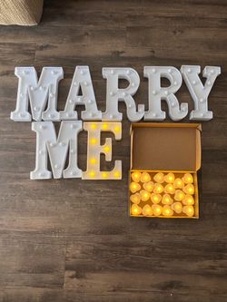 Marry Me Light Up Letters with 24 Tea Light Candles and some Red Petals