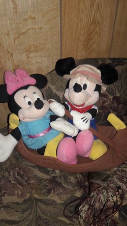 Mickey and Minnie in a boat.