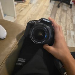 Cannon Rebel T7 Camera With Strap And Lens