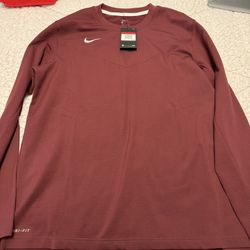 Men’s Nike long sleeve T-shirt size large and new with tags burgundy colour