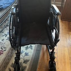 Travel Wheelchair with Leg Extensions and Cushion