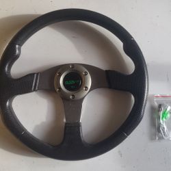 Grey RASTP steering wheel.