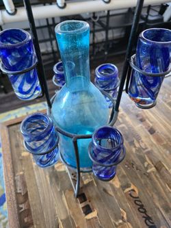 Shot glasses and bottle with holder