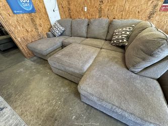 New Three Sided Large Sectional. Storage Ottoman Optional. Can Deliver.