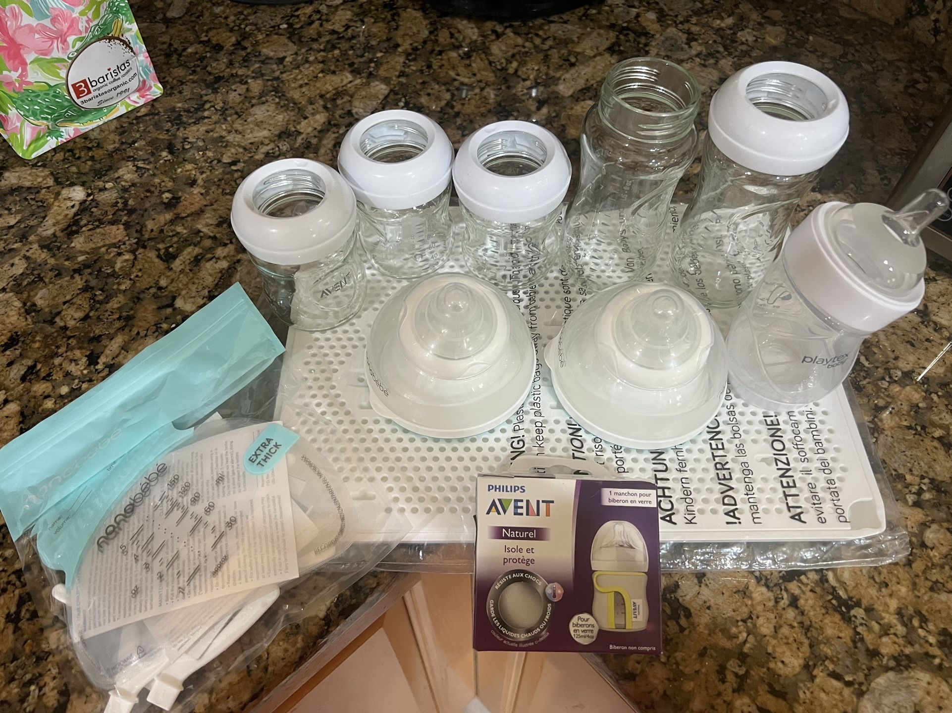5 glass Phillips avent baby bottles, 1 playtex bottle, 2 nabobebe bottle & drying rack