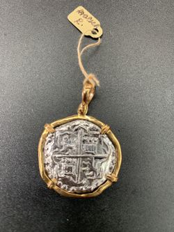 Atocha silver coin pendant in gold bezel