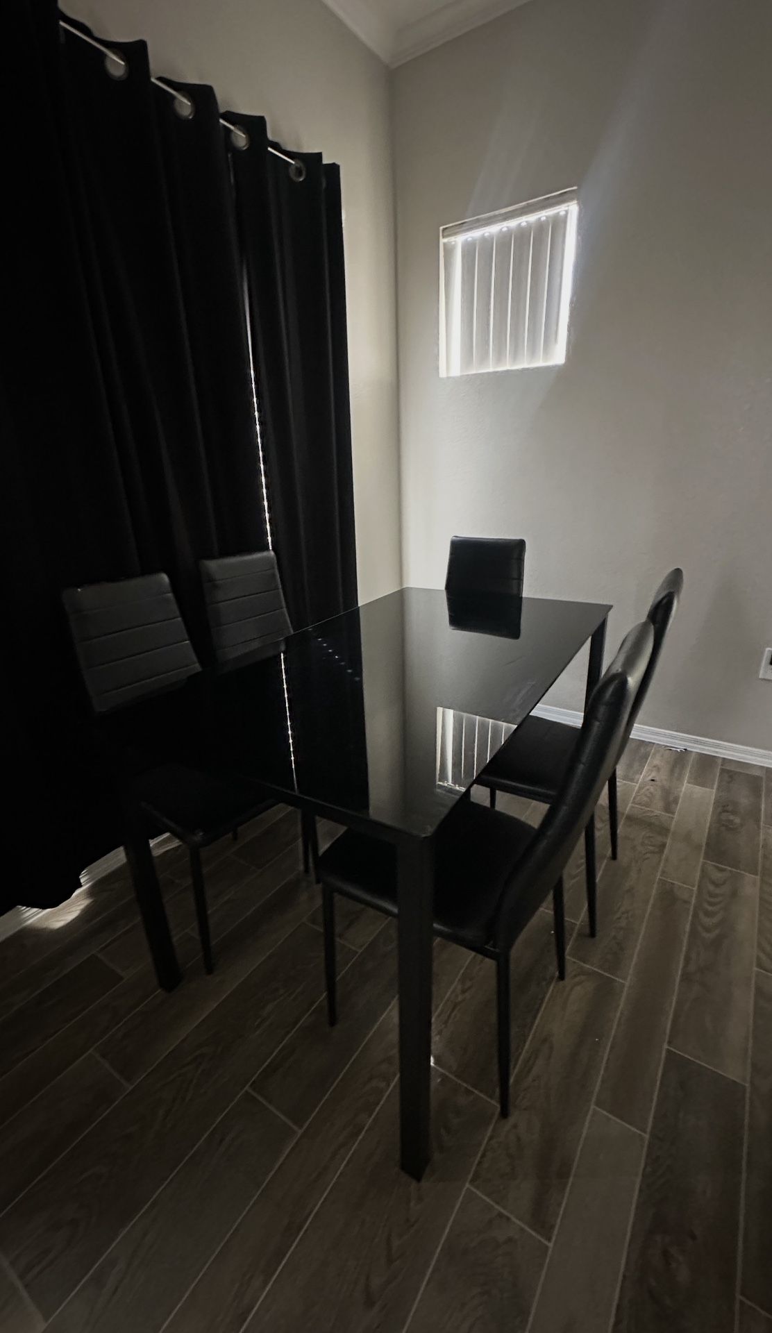 Black table with 5 chairs
