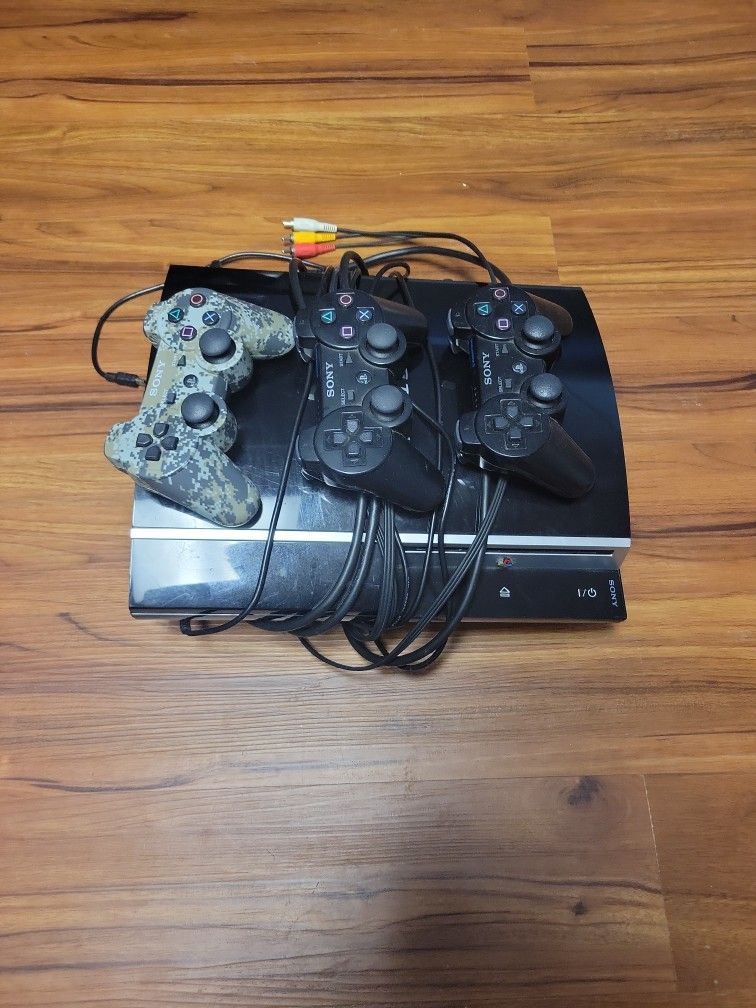 PS3 w/controllers and Games
