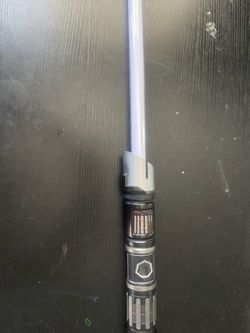 Authentic hand built Lightsaber from Savi’s workshop at Disney world! This one has the Sith crystal inside. Perfect condition and comes with shoulder 