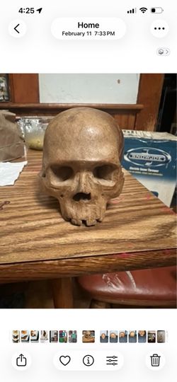 Wooden hand carved skull