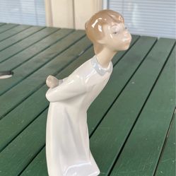 Retired vintage Lladro “Boy Blowing a Kiss” figurine, 4869