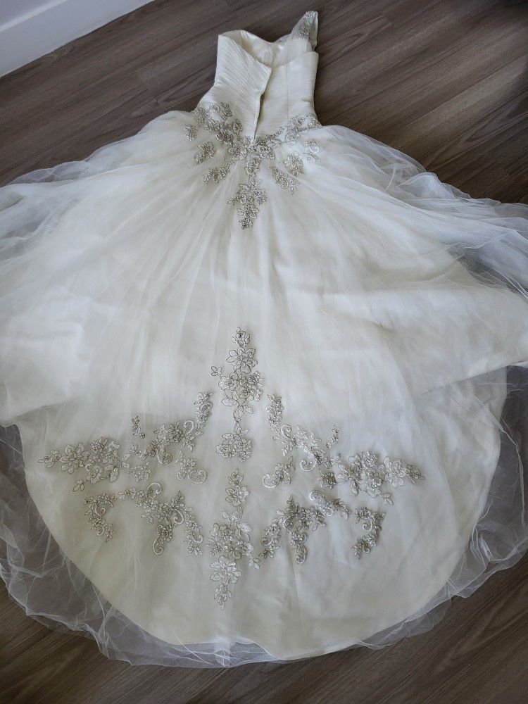 This Dress Was Used Once. It's from David's Bridal, Cost $1,200+taxes.  Asking For $300-500, Price Is Negotiable.  