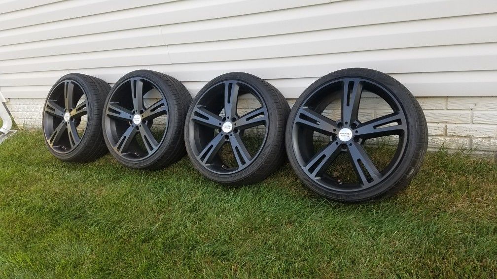 Four 20" American Racing wheels and tires