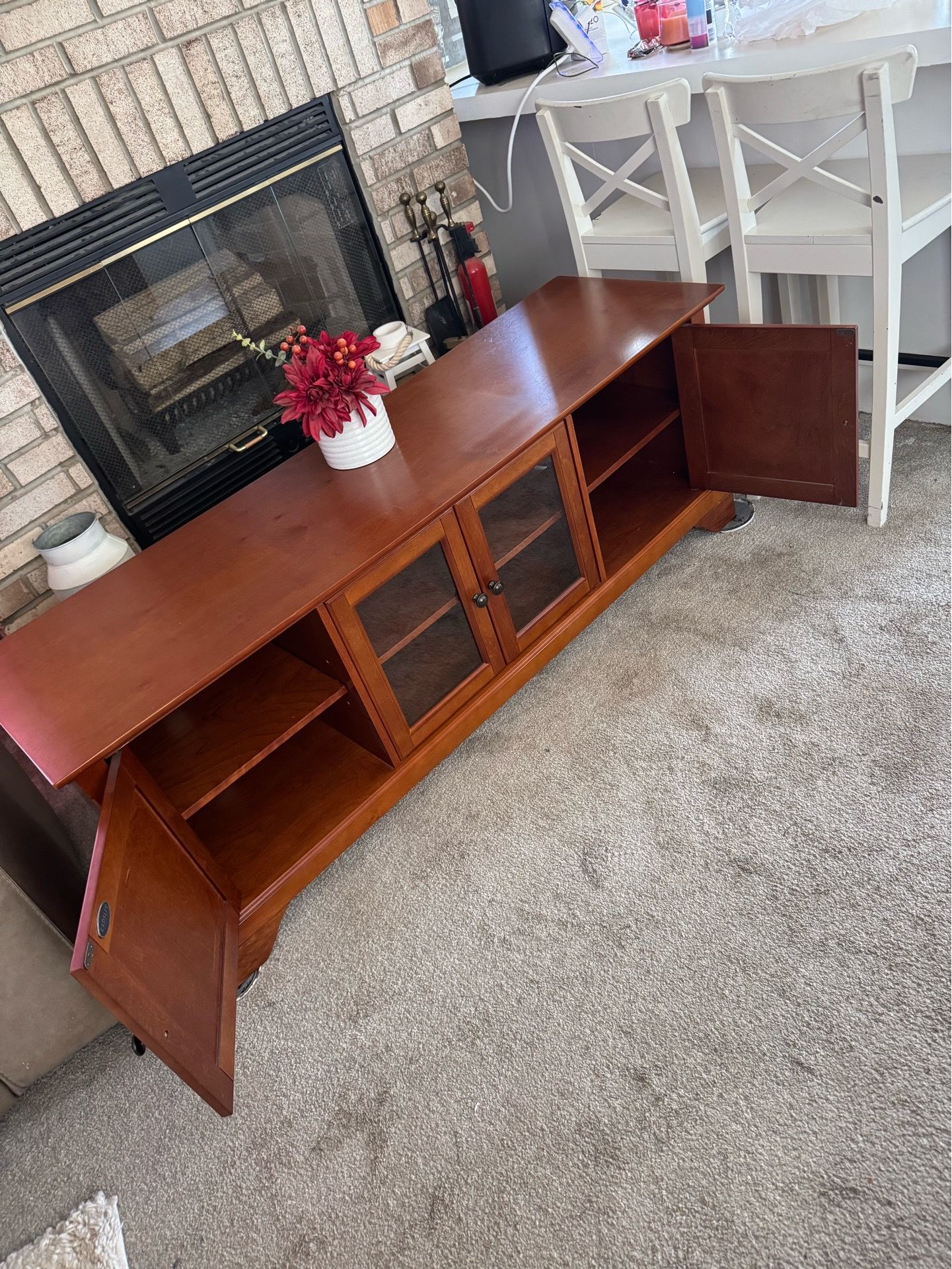 solid wood tv stand with doors.. and shelf’s.. perfect condition