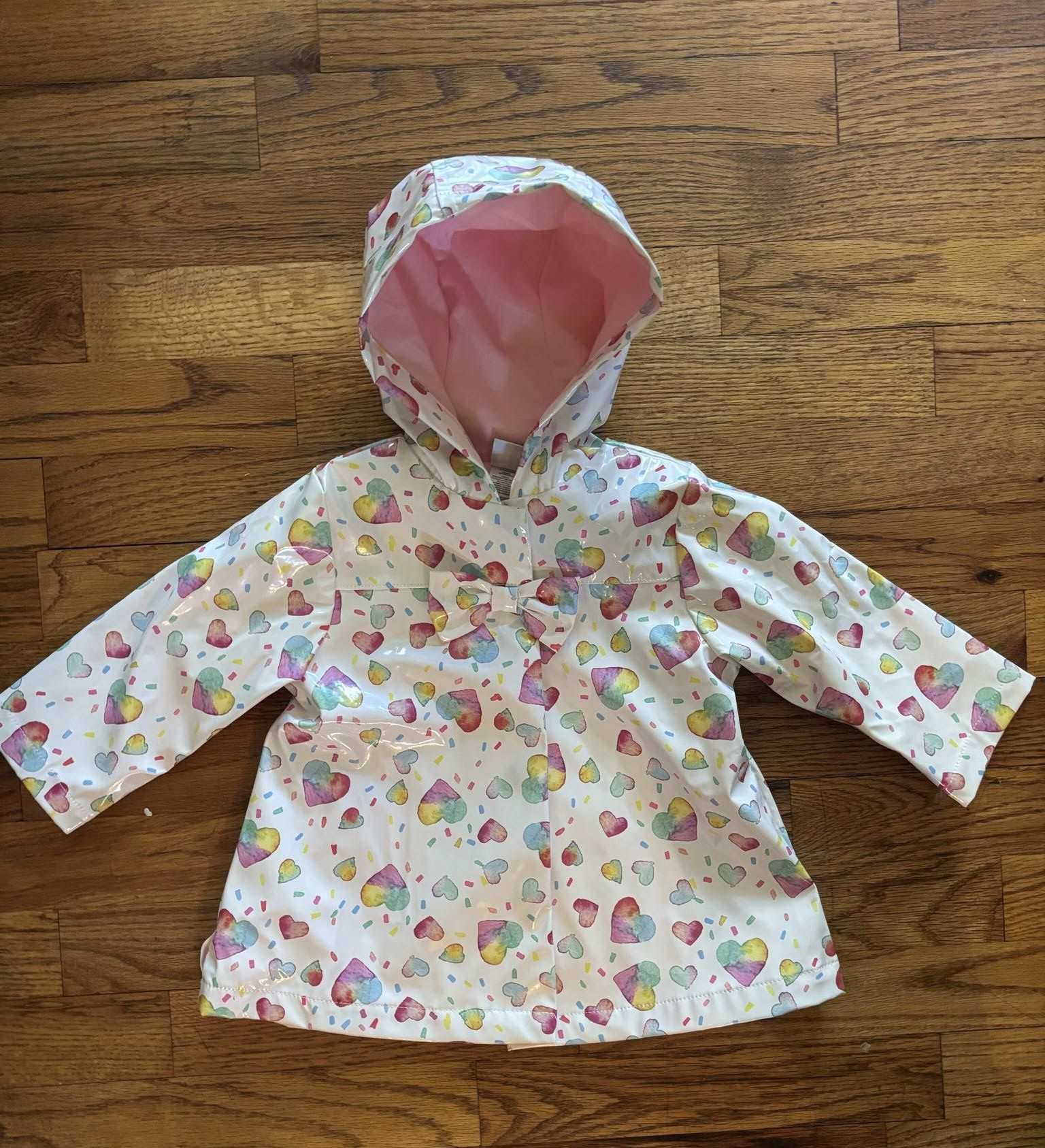 White raincoat with heart designs Baby