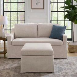 Beige Slipcovered Sofa with Ottoman