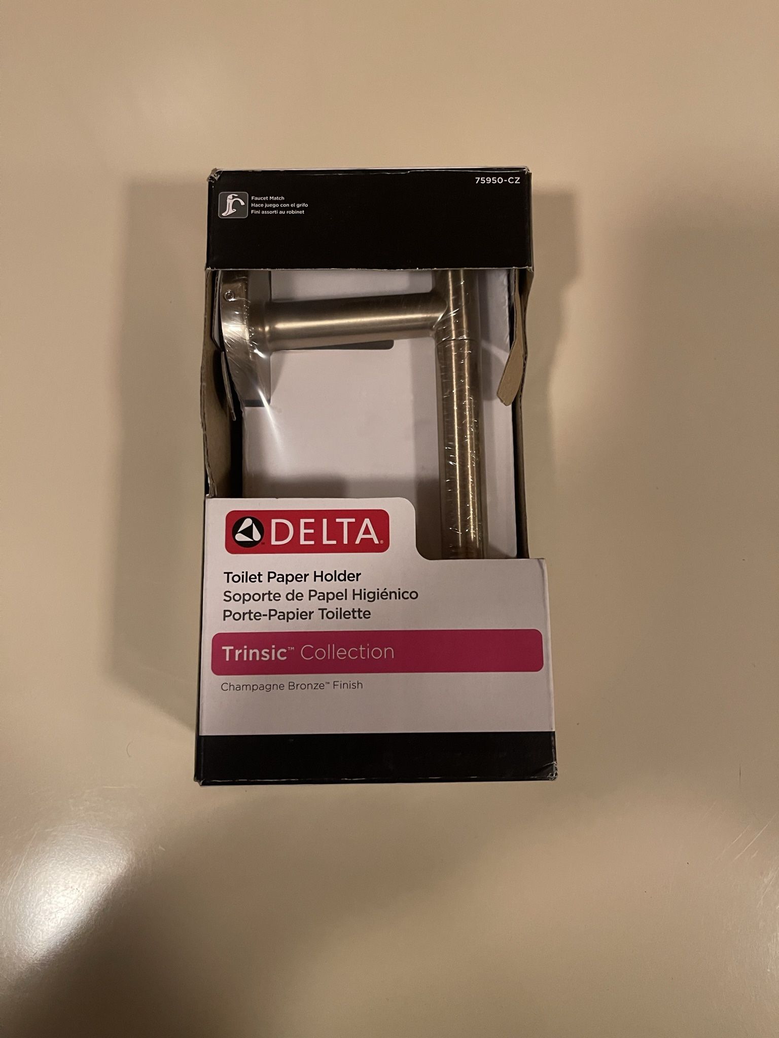 Trinsic Single Post Toilet Paper Holder in Champagne Bronze